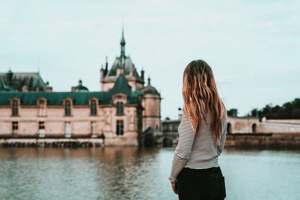 Girl by a riverside in Europe | Host Family Stay